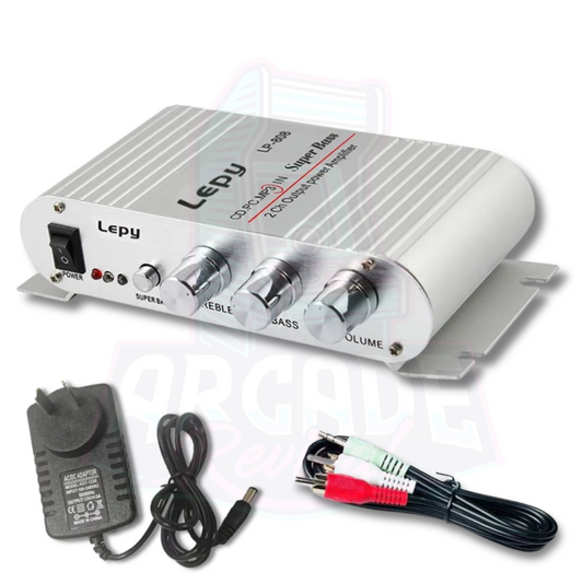 Complete amplifier kit showing the amp, power adapter, and RCA audio cables, ideal for DIY arcade builds and audio systems.