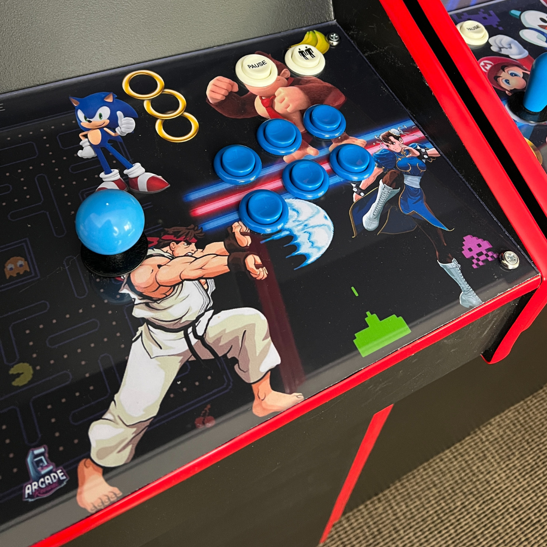 Close-up of Arcade All-Stars II control panel wrap installed on an arcade cabinet from Arcade Revival, with blue buttons, joystick, and retro artwork.