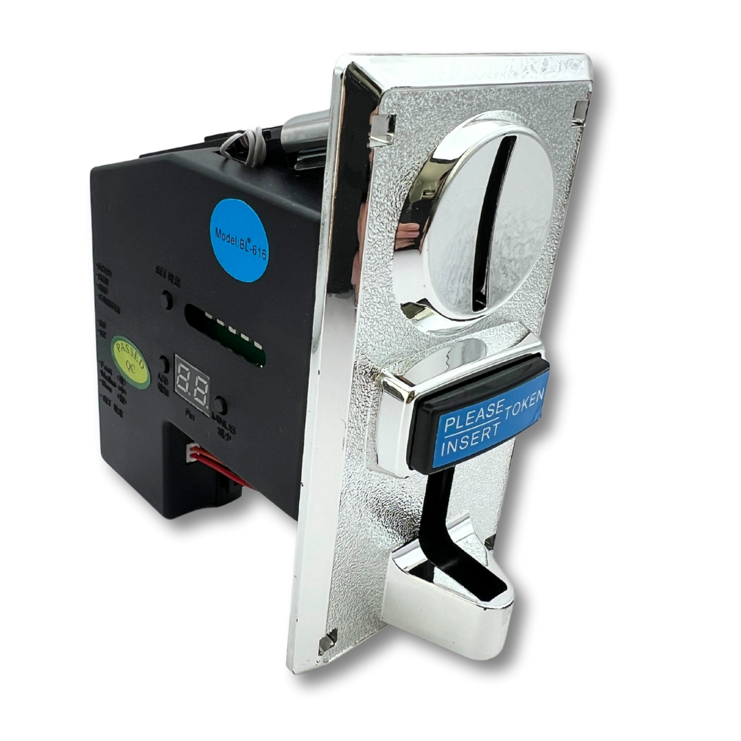 Arcade insert coin acceptor front side angle view showing faceplate and electronics at rear