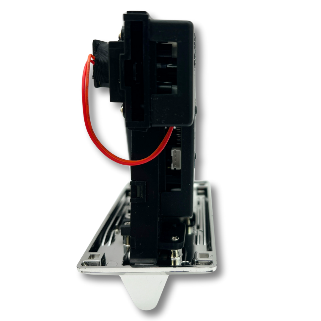 Side view of arcade coin acceptor showing compact profile and wiring layout