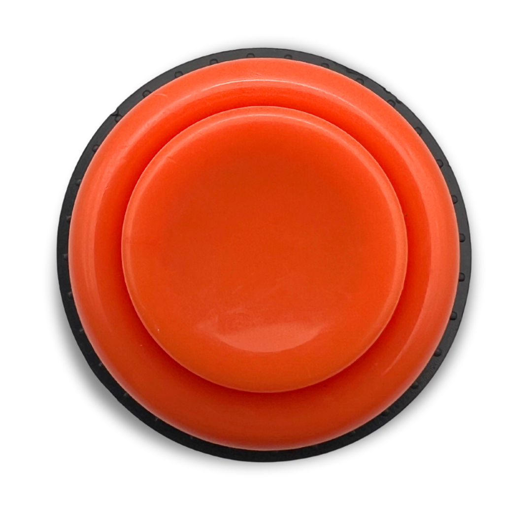 Top view of an orange arcade button with black trim