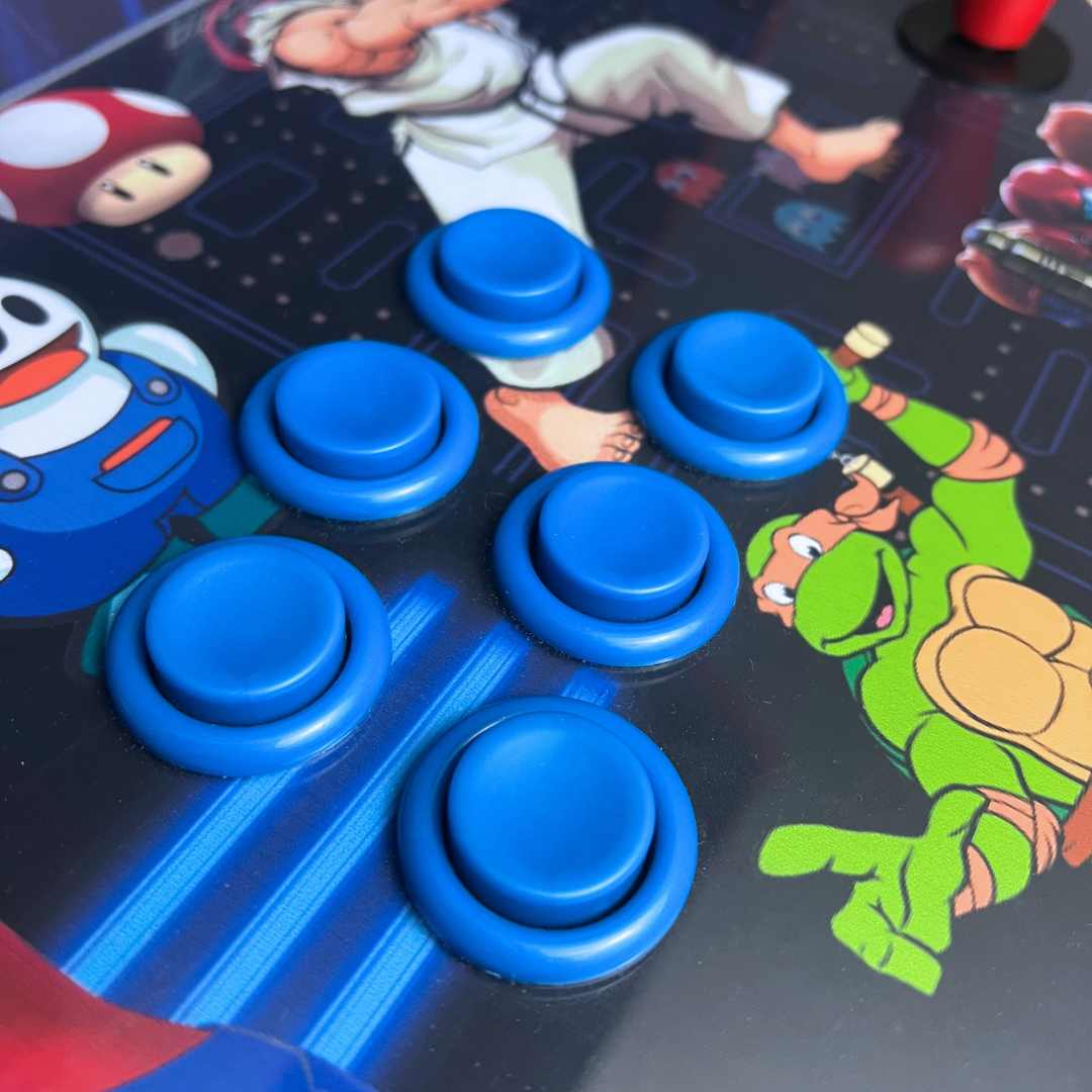 Close-up of blue arcade buttons installed on a custom retro arcade cabinet featuring classic game artwork.