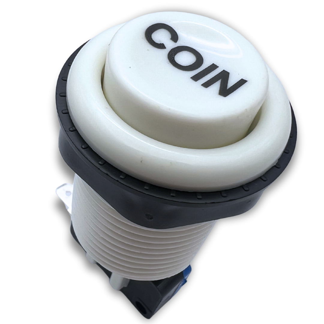 Angled top view of white coin button for arcade machines