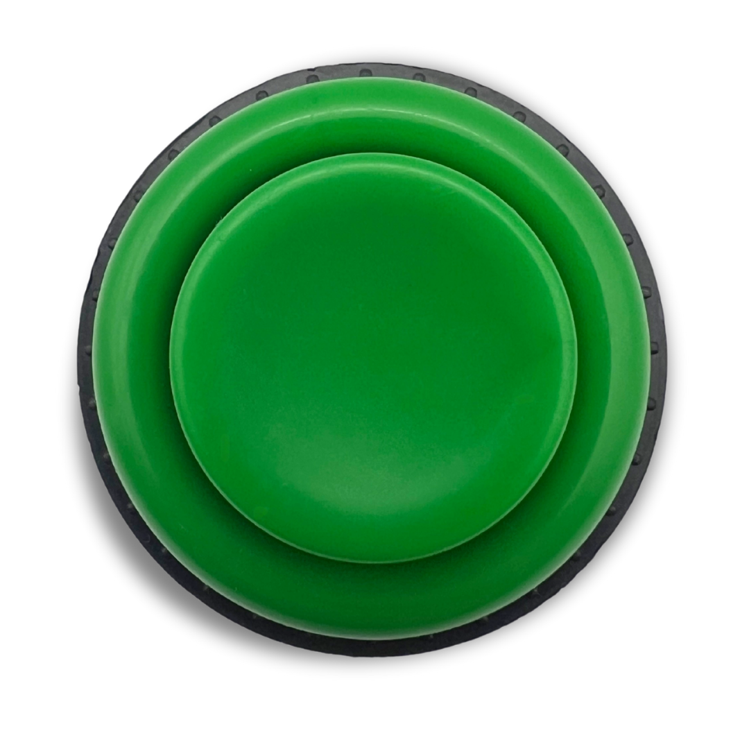Top view of green arcade button showing the round button face