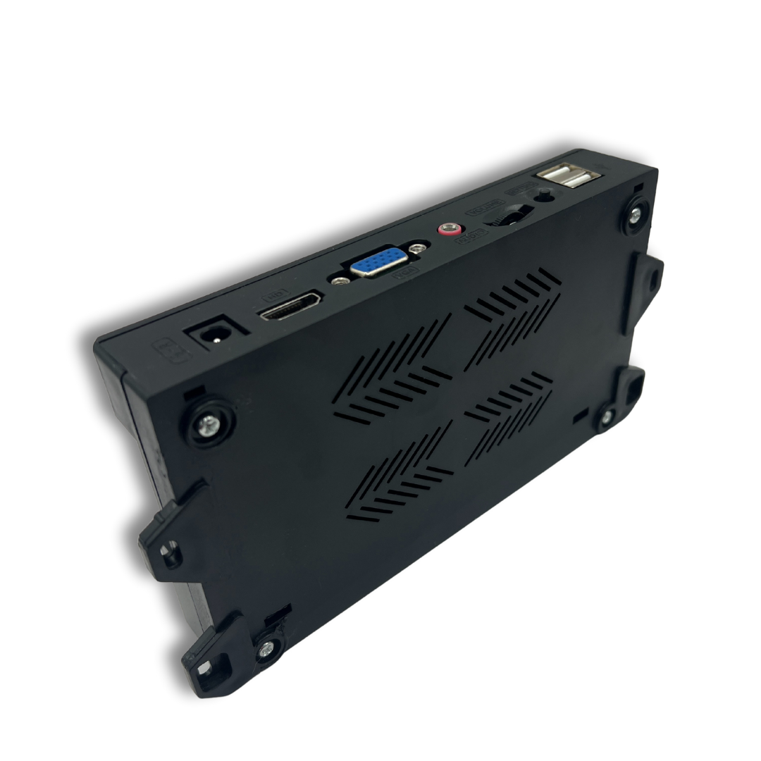 Angled underside view of Pandora DX2 9800 arcade system showing vent design and port layout.