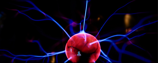 Plasma Surge arcade control panel artwork featuring a glowing red plasma orb with electric blue arcs on a dark background