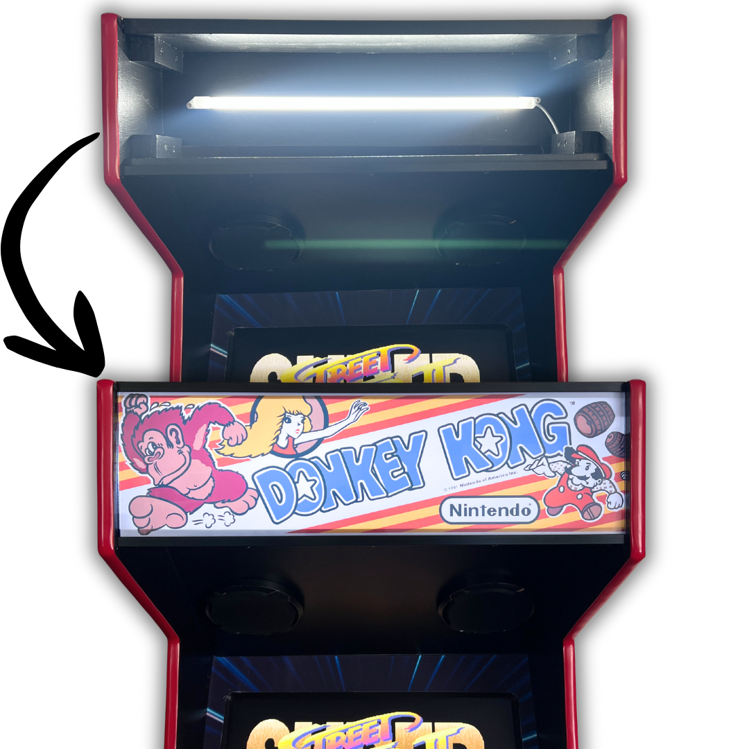 LED marquee light bar installed in arcade cabinet lighting up Donkey Kong marquee with bright white illumination.