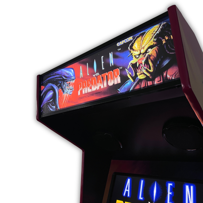 Close up angle view of Alien vs. Predator arcade marquee mounted on a DIY arcade cabinet with Alien vs. Predator gameplay screen visible below.