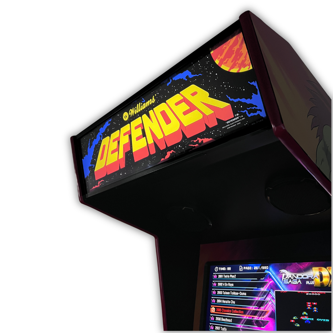 Close up angle view of Defender arcade marquee mounted on a DIY arcade cabinet with game selection screen visible below.