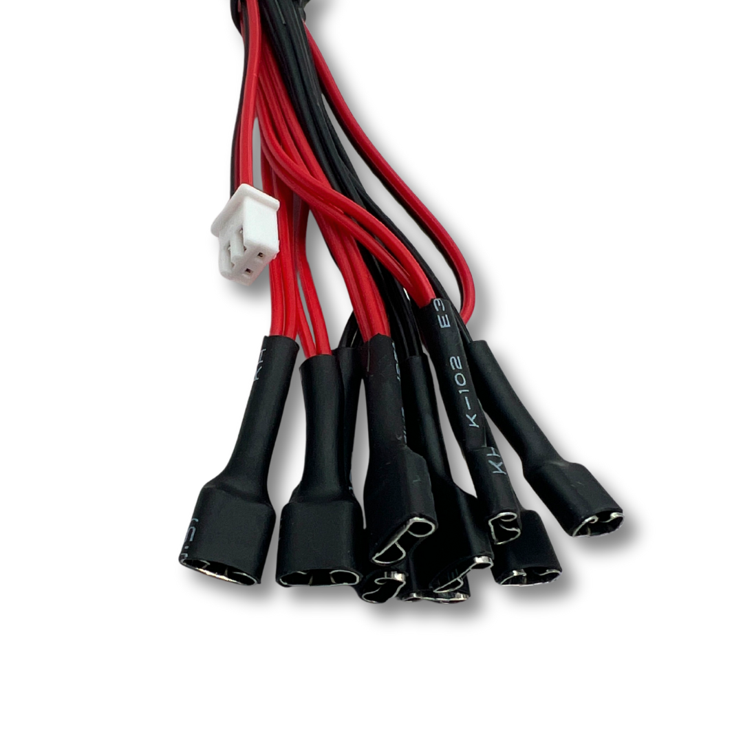 Detailed view of LED daisy chain wiring harness for arcade button lighting with insulated connectors.