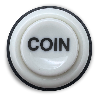 Top view of white arcade cabinet coin button with "COIN" text