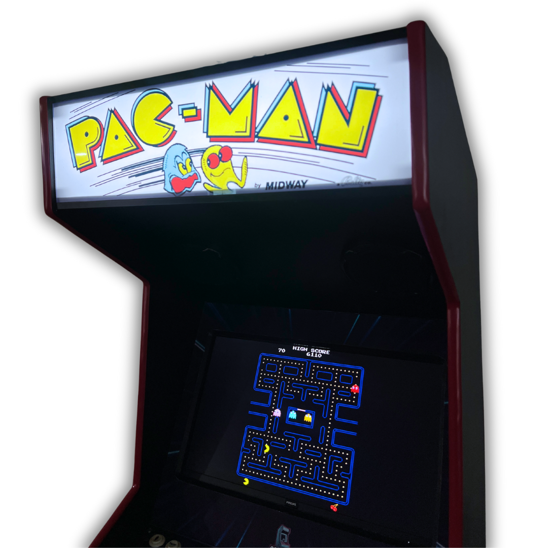 Pac-Man reproduction marquee installed on arcade cabinet, glowing brightly with vivid yellow and red lettering.