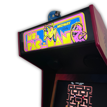 Close up angle view of Ms. Pac-Man arcade marquee mounted on a DIY arcade cabinet with gameplay screen visible below.