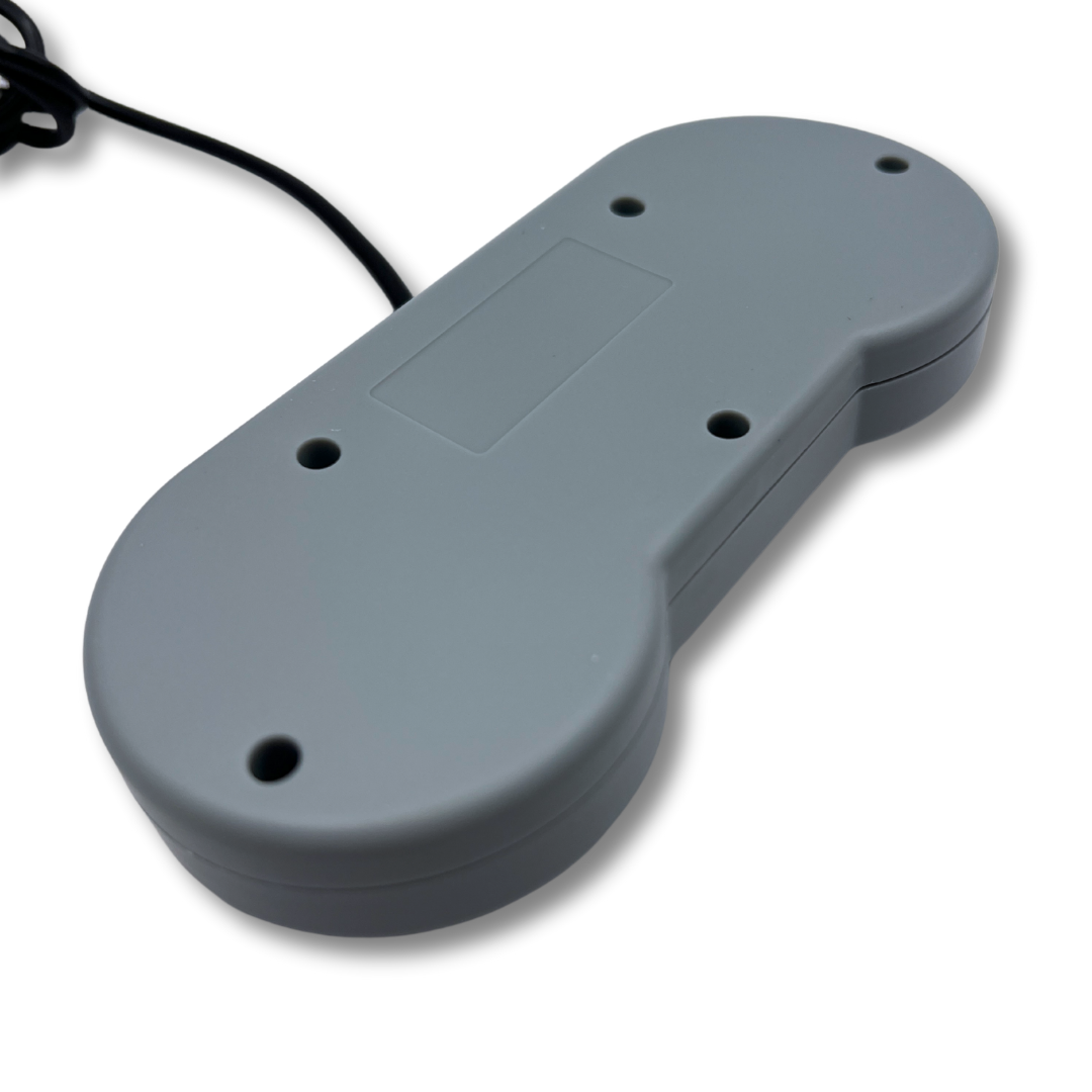 Rear angled view of SNES USB controller with screw placement and smooth matte finish for authentic build quality.