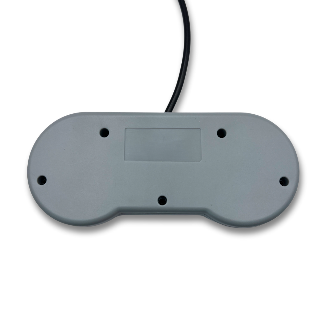 Flat back view of SNES-style USB controller showing backplate, screw holes, and cable route.