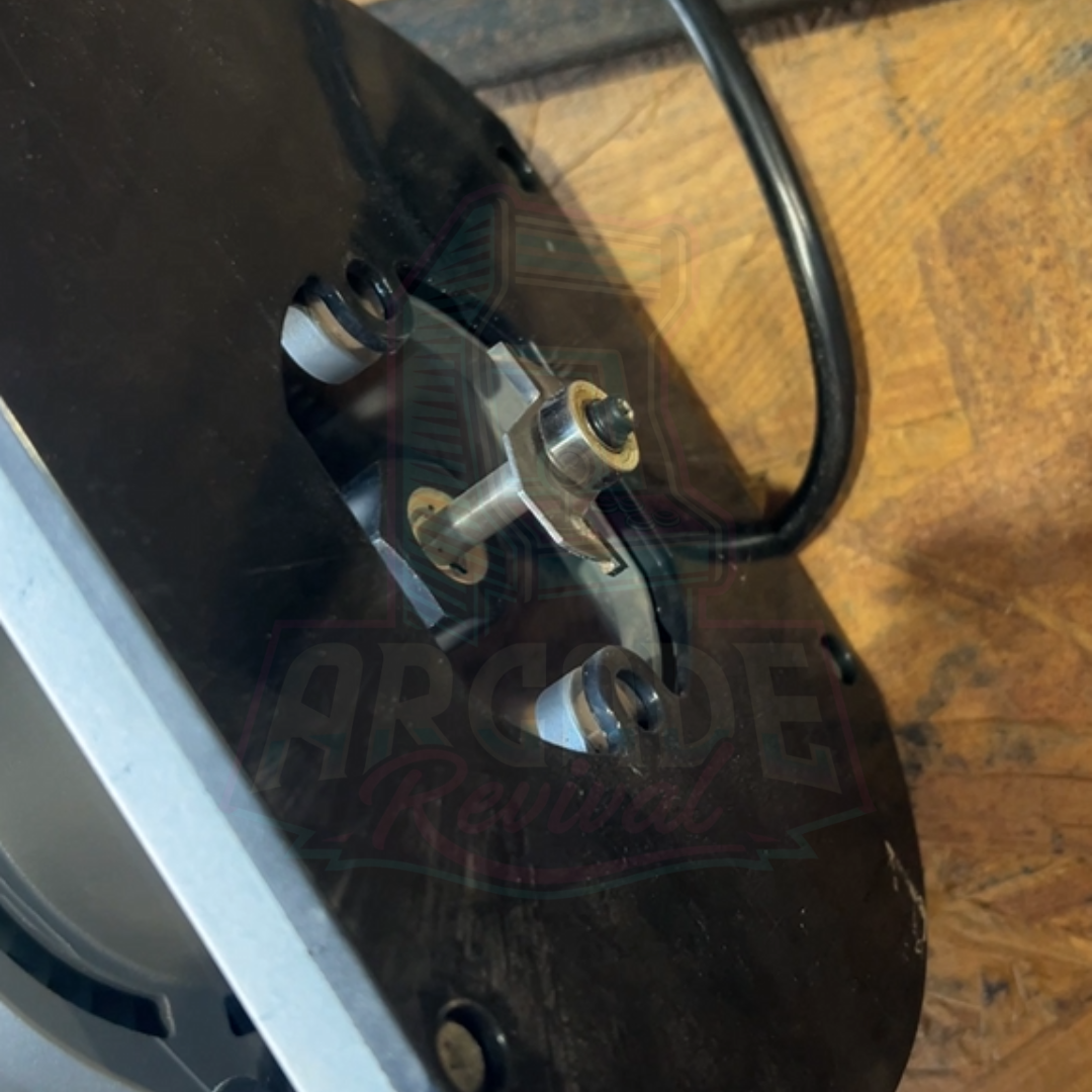 Arcade T-moulding slot router bit installed into the base of a router, ready for cabinet cutting