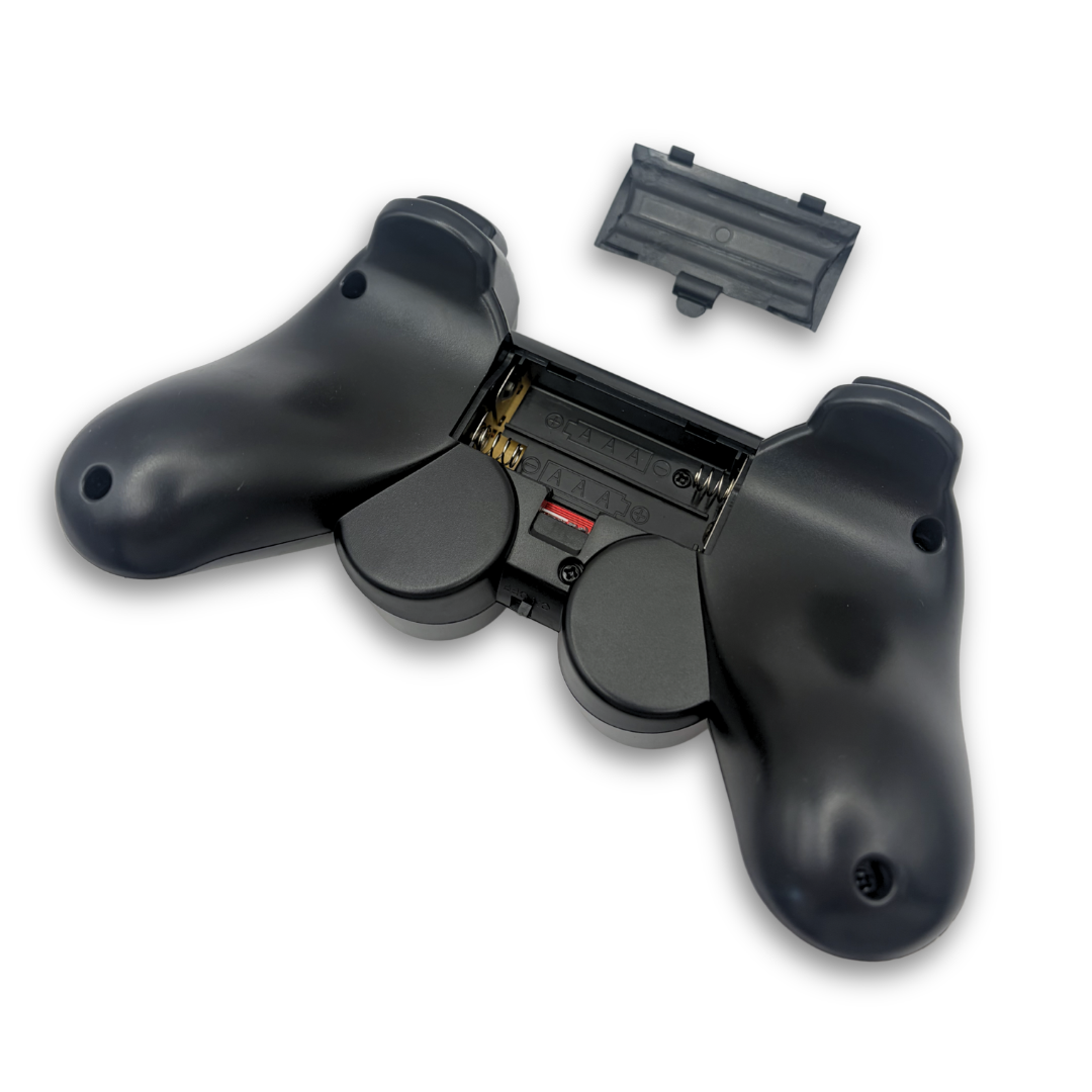 Black wireless PS gamepad controller with battery compartment open showing AAA battery slot